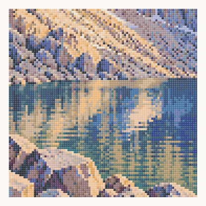 Enlarged local square-diamond simulation of the cliff base, lake reflections and boulder shore. Digital detail, not a finished sample photograph.
